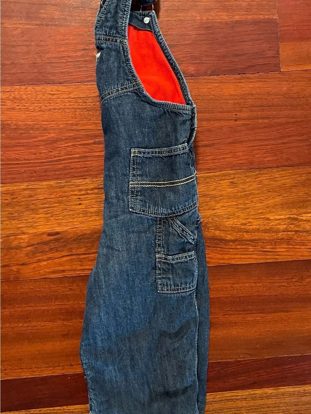 OshKosh B'gosh Indigo Denim Overalls with red fleece lining and snap legs